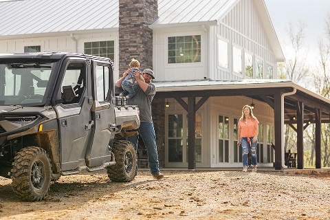 Family checks the progress of their new barndominium construction project