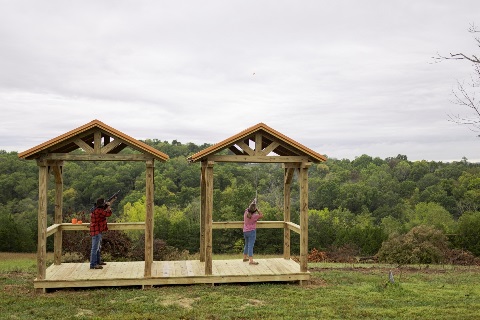 Buchanan family skeet shoots on their 100 acre property with a log home