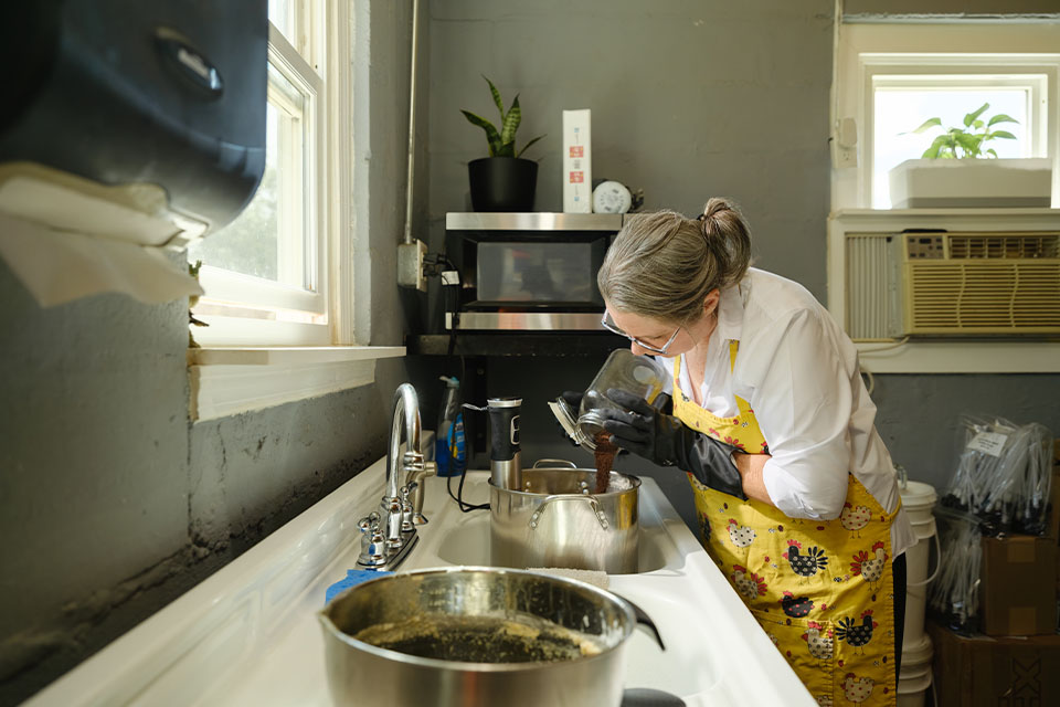 Rural 1st customer Suzanne Harper mixes soap on her rural Tennessee property.